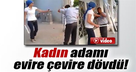 Kadin, adami sopayla dövdü