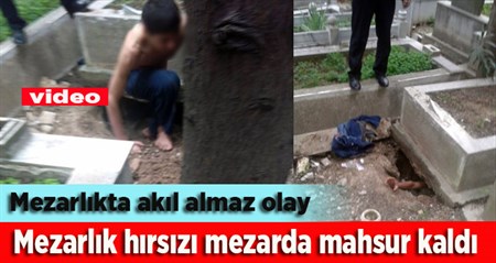 Dis çalmak için girdigi mezarda mahsur kaldi