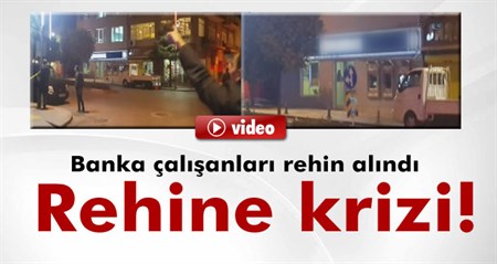 Çarsafli sahis banka çalisanlarini rehin aldi