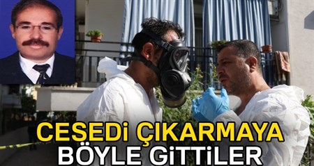 Emekli ögretmenin cesedini çikarmak için maske taktilar