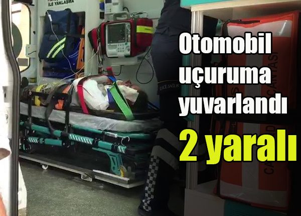 Otomobil uçuruma yuvarlandi: 2 yarali