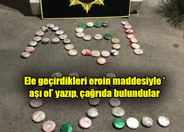 Ele geçirdikleri eroin maddesiyle ‘asi ol’ yazip, çagrida bulundular